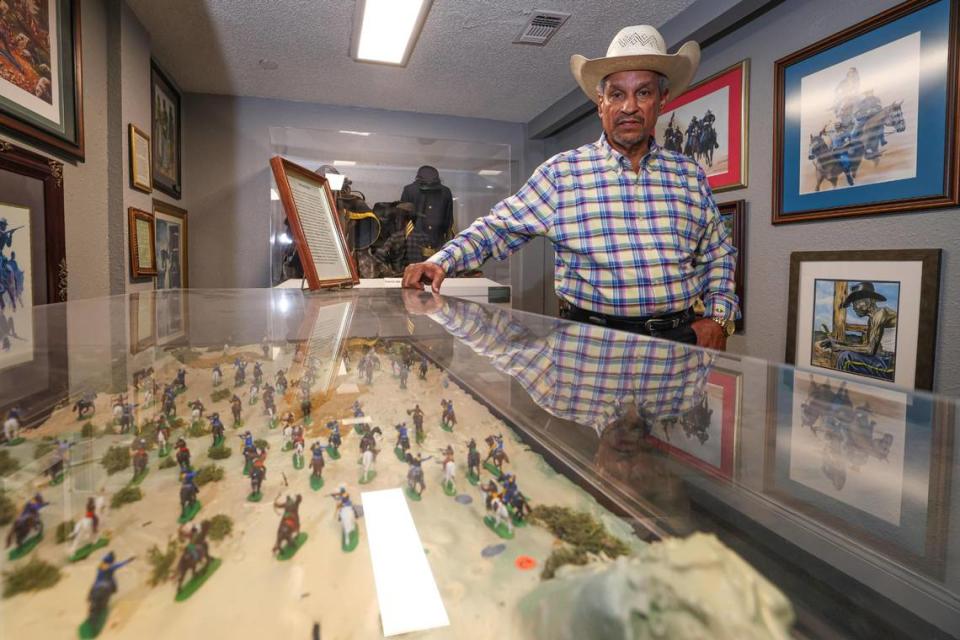 Jim Austin, a co-founder of the National Multicultural Western Heritage Museum in Fort Worth, showcases his exhibit on the Buffalo Soldiers, a group of Black soldiers who helped protect the nation’s westward expansion.