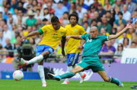 LONDON, ENGLAND - AUGUST 11: Alex Sandro of Brazil (L) battles for the ball with Jorge Enriquez of Mexico during the Men's Football Final between Brazil and Mexico on Day 15 of the London 2012 Olympic Games at Wembley Stadium on August 11, 2012 in London, England. (Photo by Michael Regan/Getty Images)