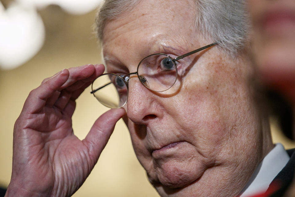 Senate Majority Leader Mitch McConnell of Ky., adjusts his glasses as he and other members of the Senate Republican leadership speak to the media after a weekly policy luncheon, Tuesday, July 16, 2019, in Washington. "Everybody ought to tone down their rhetoric," said McConnell. (AP Photo/Jacquelyn Martin)