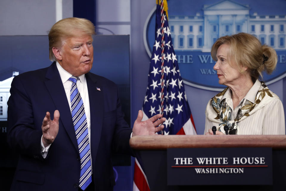 President Donald Trump asks a question to Dr. Deborah Birx, White House coronavirus response coordinator, during a briefing about the coronavirus in the James Brady Briefing Room, Monday, March 23, 2020, in Washington. (AP Photo/Alex Brandon)