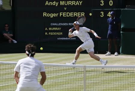 Andy Murray of Britain hits a shot during his match against Roger Federer of Switzerland at the Wimbledon Tennis Championships in London, July 10, 2015. REUTERS/Stefan Wermuth