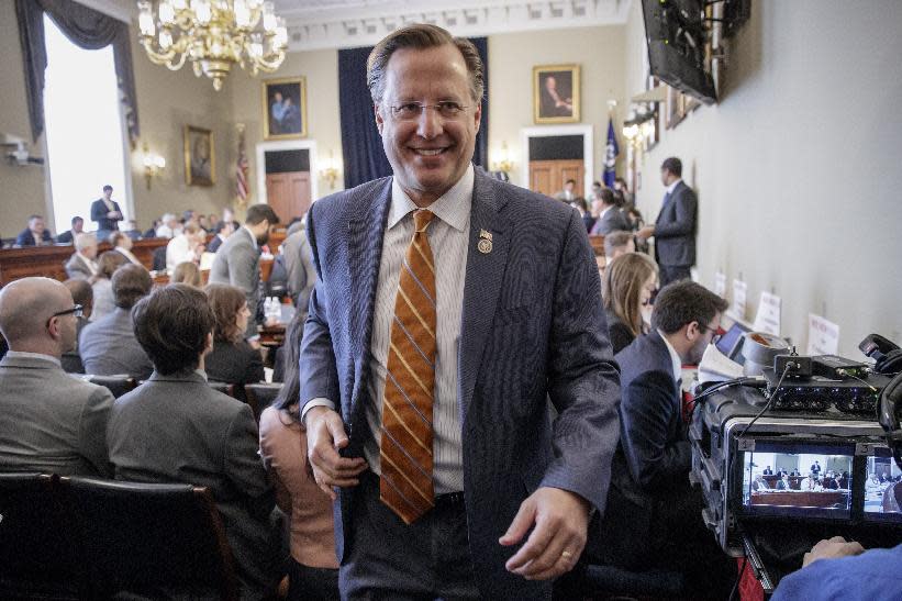 Rep. Dave Brat, R-Va., center, a member of the House Freedom Caucus leaves the House Budget Committee hearing on Capitol Hill in Washington, Thursday, March, 16, 2017, during the committee's health markup. (AP Photo/J. Scott Applewhite)