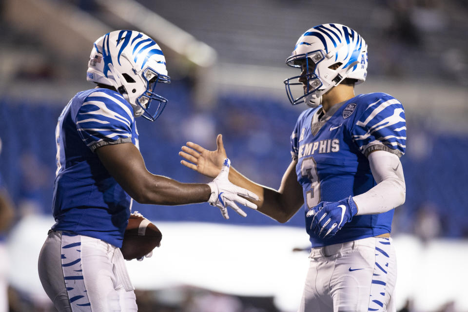 Brady White, right, made some nice throws in the opener, including a pretty TD pass to Sean Dykes, left, against Arkansas State. (Photo by Brett Carlsen/Getty Images)