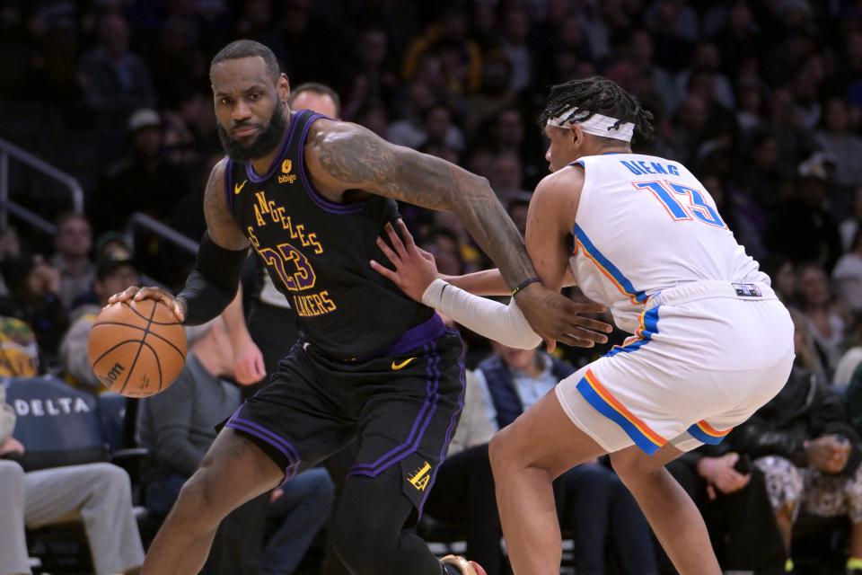 Jan 15, 2024; Los Angeles, California, USA; Los Angeles Lakers forward LeBron James (23) drives past Oklahoma City Thunder forward Ousmane Dieng (13) in the first half against the Oklahoma City Thunder at Crypto.com Arena. Mandatory Credit: Jayne Kamin-Oncea-USA TODAY Sports