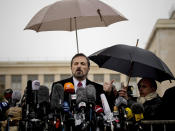 Louay Safi, center, spokesperson for the Syrian National Coalition, Syria's main political opposition group, gestures during a press briefing at the United Nations headquarters in Geneva, Switzerland, Switzerland, Monday, Feb 10, 2014. Syrian government and opposition delegates began a fresh round of U.N.-brokered peace talks Monday, but prospects for common ground appeared unlikely as the two sides traded accusations over weekend violence that disrupted food distribution meant to ease the plight of civilians. (AP Photo/Anja Niedringhaus)