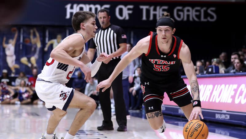 Utah’s Gabe Madsen drives against St. Mary’s Aidan Mahaney during the second half of an NCAA college basketball game in Moraga, Calif., on Monday, Nov. 27, 2023. 