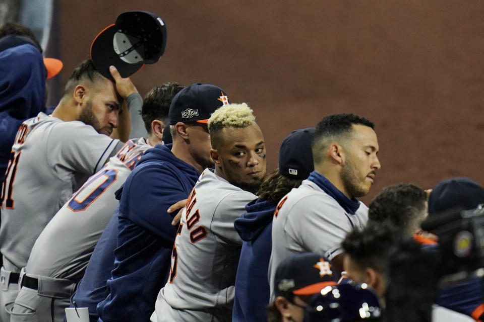 The Houston Astros watch the top of the ninth inning against the Tampa Bay Rays in Game 1 of a baseball American League Championship Series, Sunday, Oct. 11, 2020, in San Diego. (AP Photo/Gregory Bull)