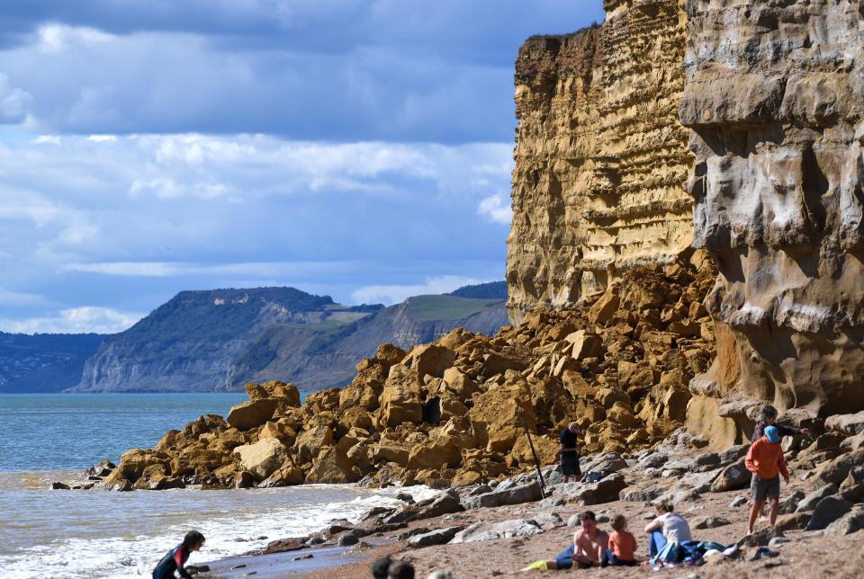 BURTON BRADSTOCK, UNITED KINGDOM - AUGUST 29: General view of the 9,000 ton cliff fall on August 29, 2020 in Burton Bradstock, Dorset, England. The fall happened at Hive Beach near the village of Burton Bradstock shortly before 06:30 BST, Dorset Council said. Fire crews using thermal imaging equipment were called in to check for any trapped casualties but nothing was found. The council described it as a "huge" rock fall and said recent heavy rain had made cliffs unstable. (Photo by Finnbarr Webster/Getty Images)