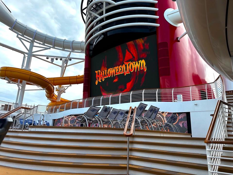 "Halloweentown" plays across the Funnel Vision screen on the pool deck of the Disney Wish.