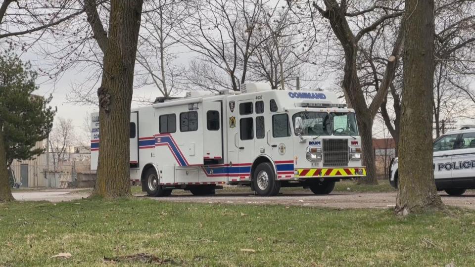 Police vehicles are staged in the south end of Jackson Park. 