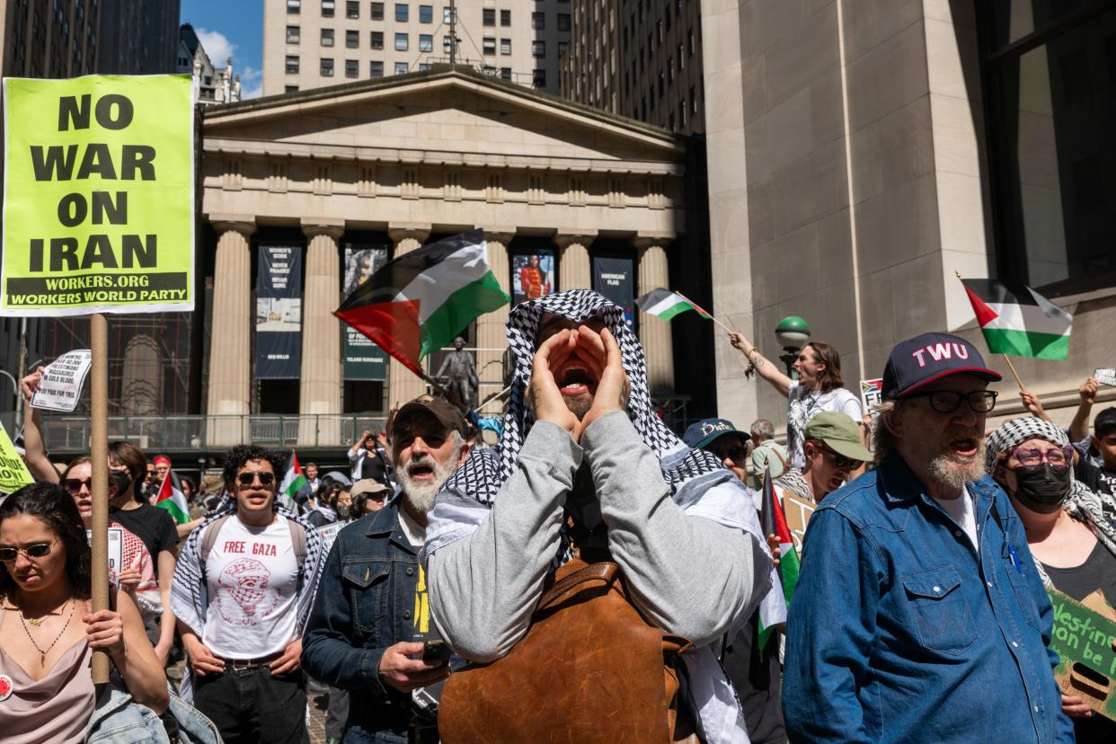 Pro Palestinian protesters confront a small group of Israeli demonstrators during dueling events outside of the New York Stock Exchange (NYSE) on April 15, 2024 in New York City. While Palestinian protesters outnumbered those in support of Israel, the two groups clashed at times with at least one arrest as tensions in the Middle East continue to spill out into the streets around the world.