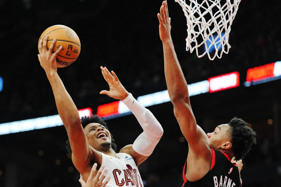 Cleveland Cavaliers forward Isaac Okoro (35) shoots over Toronto Raptors forward Scottie Barnes (4) during the second half of an NBA basketball game, Saturday, Feb. 10, 2024 in Toronto. (Frank Gunn/The Canadian Press via AP)