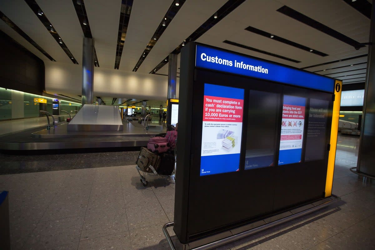 Baggage processing at Heathrow Airport Terminal 2 (PA)