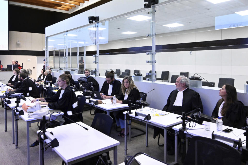 Lawyers attend the courtroom prior to the reading of the sentences during the trial regarding the attacks at a Brussels metro station and the city's airport at the Justitia building in Brussels, Friday, Sept. 15, 2023. The morning rush hour attacks at Belgium's main airport and on the central commuter line took place on March 22, 2016, which killed 32 people, and nearly 900 others were wounded or suffered mental trauma. (John Thys, Pool Photo via AP)