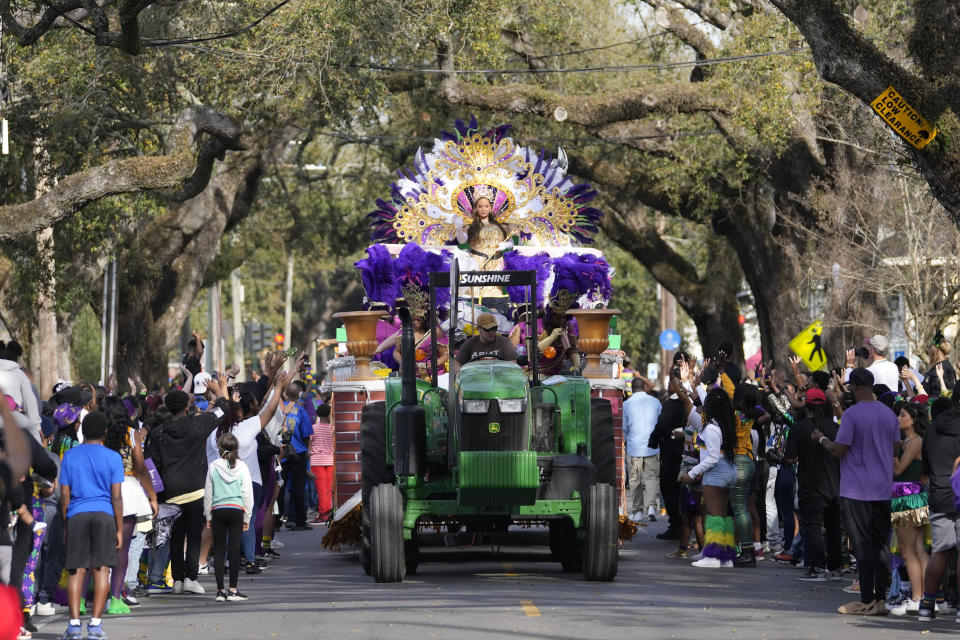 Queen of Zulu Dr. Christy Lagarde Spears rides on a float during the traditional Krewe of Zulu Parade on Mardi Gras Day in New Orleans, Tuesday, Feb. 21, 2023. (AP Photo/Gerald Herbert)