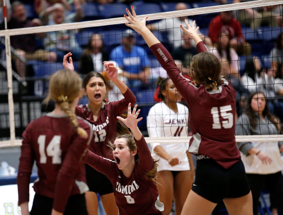 Edmond Memorial's Annie Hopkins (8) celebrates a point during last year's Class 6A state volleyball championship match against Jenks.