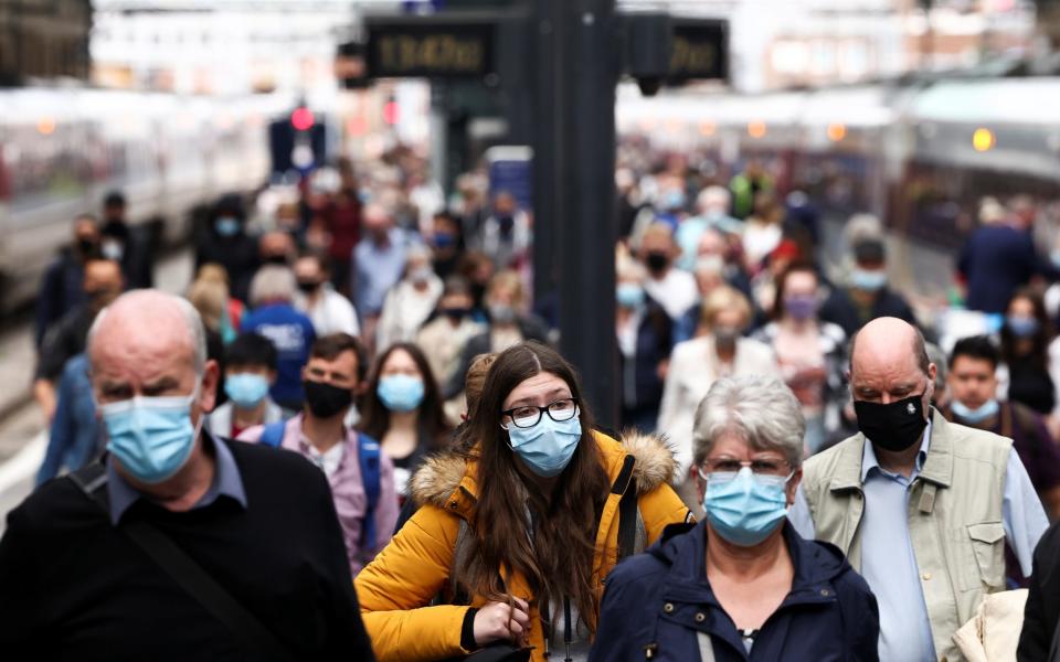 Commuters at King's Cross Station this morning don their masks, a week before Freedom Day - Henry Nicholls/Reuters