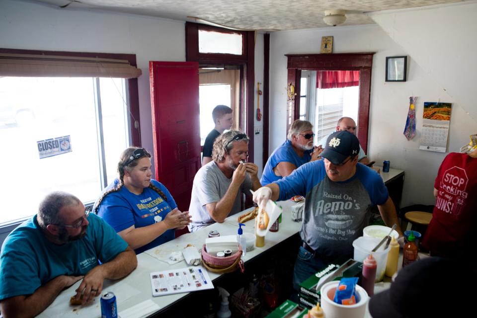 Rob Rocchi serves hotdogs at Remo's Italian Hotdog's in Gallipolis, Ohio, on Thursday, Sept. 12, 2019. Rob is the current owner and son of Remo's Rocchi the founder of Remo's Italian Hotdogs who is now deceased. 