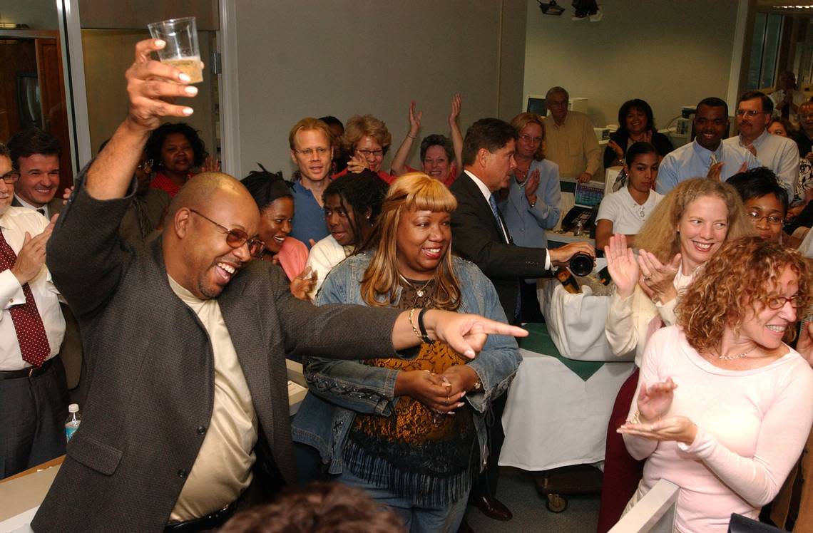 In this file photo from April 5, 2004, Leonard Pitts Jr. toasts his newsroom colleagues as he accepts congratulations for receiving the Pulitzer Prize for Commentary in the Miami Herald’s former newsroom at One Herald Plaza.