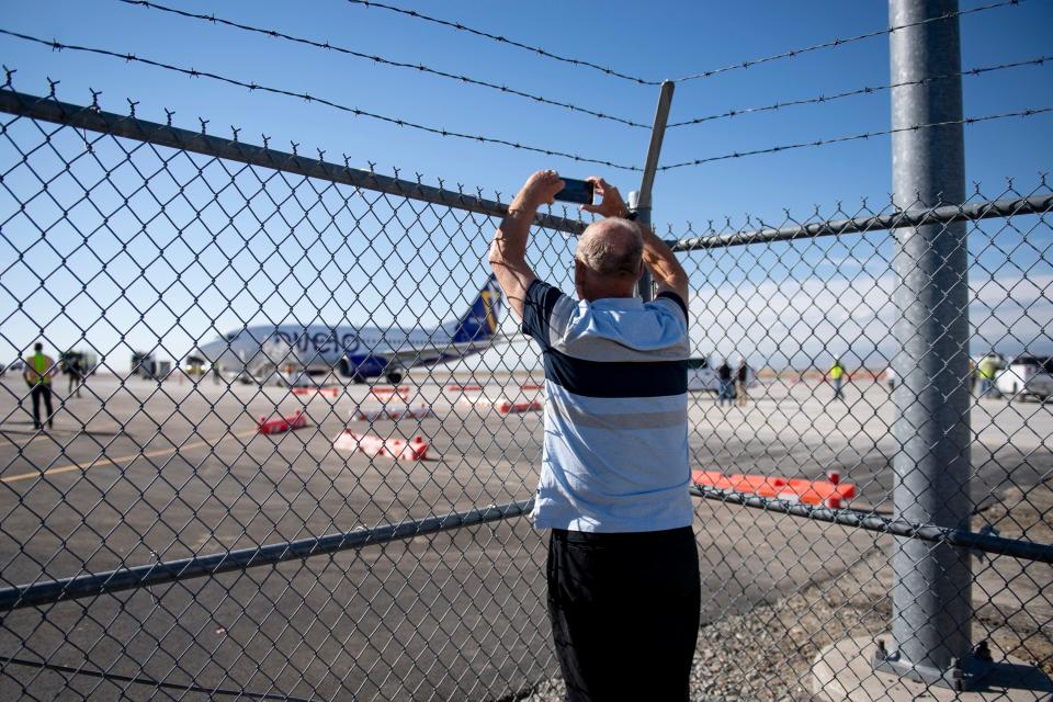 Steve Olson, Loveland City Council member, takes photos of Avelo Airlines Boeing 737-800 passenger plane during its arrival to Northern Colorado Regional Airport from Burbank, California on Oct. 6, 2021. The airline no longer flies to and from Northern Colorado after several attempts by commercial airline companies to provide passenger service out of the airport.