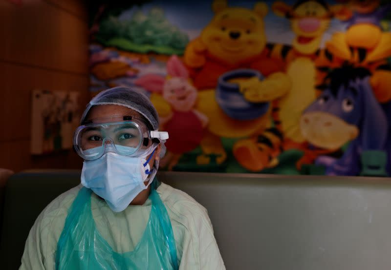 Medical workers treat patients infected with the coronavirus disease (COVID-19) at a hospital in New Delhi