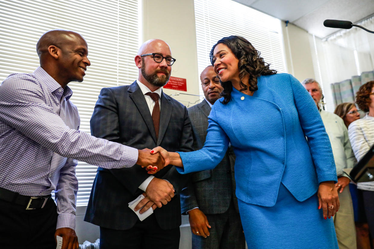 Mayor London Breed, right, shakes hands with Dr. Hyman Scott at Zuckerberg San Francisco Hospital on Sept. 10, 2019. (Gabrielle Lurie / The San Francisco Chronicle via Getty Images file)