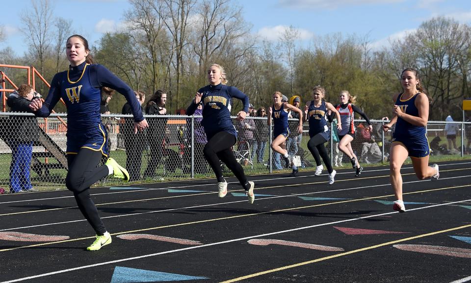 Mackenzie Ulery of Whiteford wins the 100-meter dash easily in a meet against Erie Mason and Summerfield on Tuesday, April 18, 2023. Second was Kaylie Bash of Mason and third was Madelyn Thomas of Whiteford.