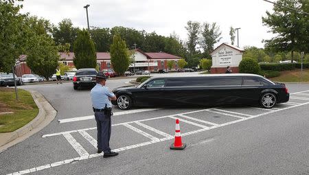 Family members arrive by police escort for the funeral of Kristina Bobbi Brown, the only child of singer Whitney Houston at Saint James United Methodist Church in Alpharetta, Georgia August 1, 2015. REUTERS/Tami Chappell