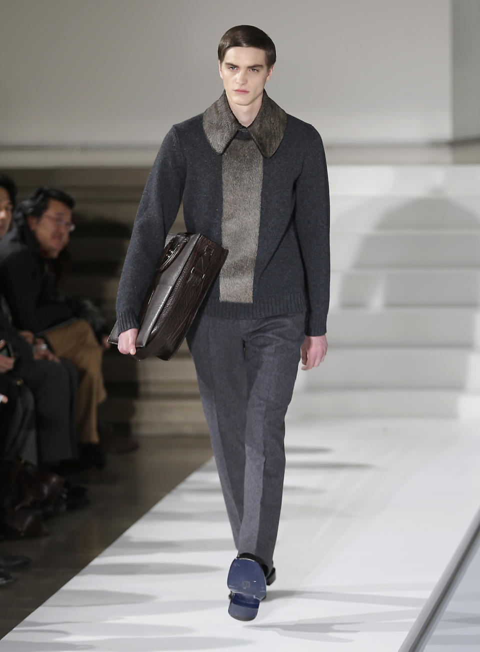 A model wears a creation of Jil Sander men's Fall-Winter 2013-14 collection, part of the Milan Fashion Week, unveiled in Milan, Italy, Saturday, Jan. 12, 2013. (AP Photo/Antonio Calanni)