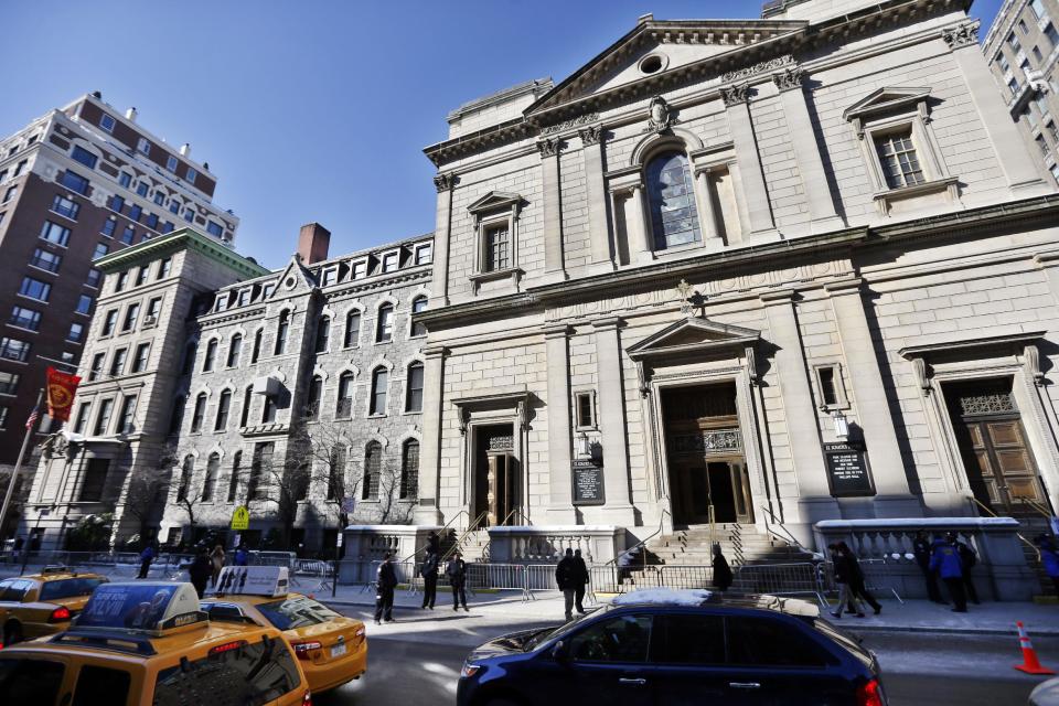 Barricades are placed outside of the Church of St. Ignatius Loyola before the funeral of actor Philip Seymour Hoffman Friday, Feb. 7, 2014, in New York. Hoffman, 46, was found dead Sunday of an apparent heroin overdose. (AP Photo/Jason DeCrow)