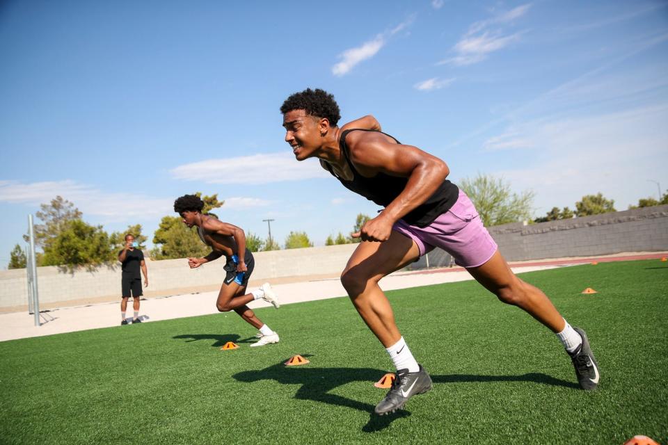 Las Vegas Bishop Gorman cornerback Justyn Rhett, near, works out with UNLV defensive back Rashod Tanner on Monday, Aug. 17, 2020. Rhett, a four-star recruit in the 2023 class, verbally committed to Notre Dame on Dec. 11, 2021.