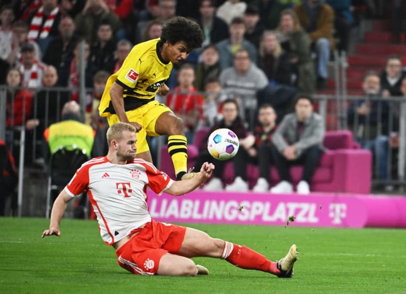 Dortmund's Karim Adeyemi (above) and Bayern's Matthijs de Ligt in action during German Bundesliga soccer match between Bayern Munich and Borussia Dortmund at the Allianz Arena. Sven Hoppe/dpa
