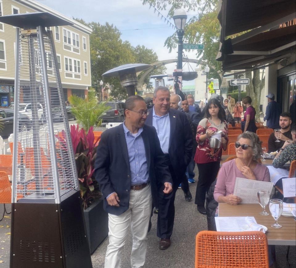 Former Cranston Mayor and GOP Congressional candidate Allan Fung walks through Federal Hill with former New Jersey Gov. Chris Christie while campaigning Monday afternoon.