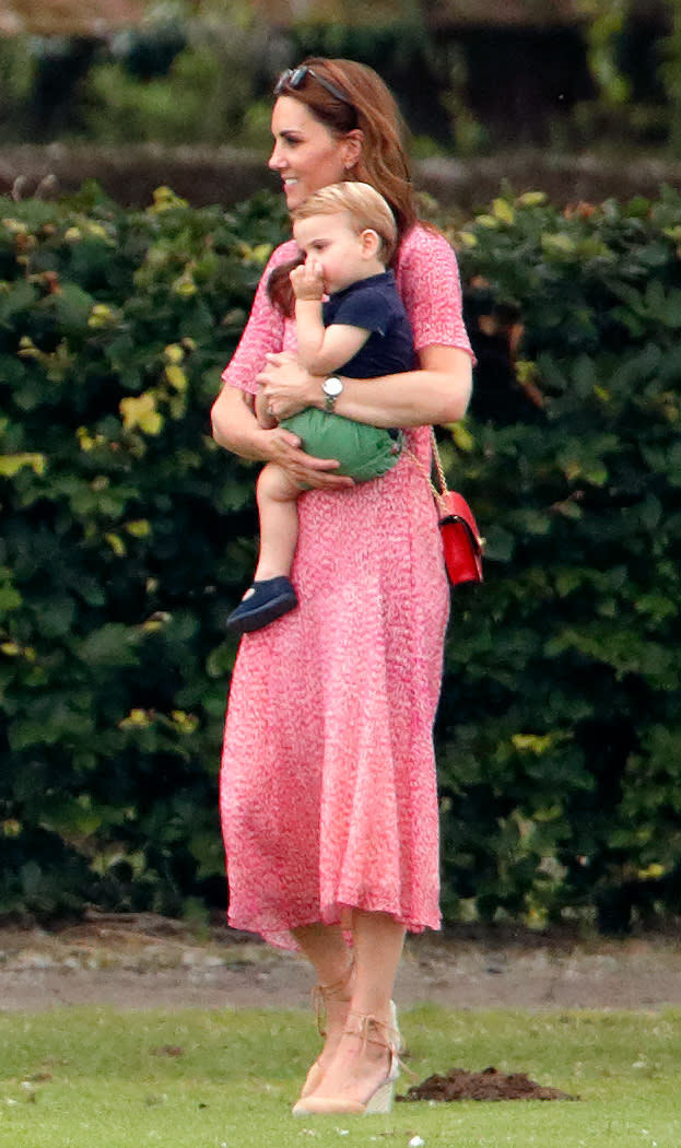 The mother-of-three wore a £325 LK Bennett dress for a family trip to the polo which promptly sold out. She accessorised the ensemble with her go-to pair <a href="https://fave.co/2NinS1Z" rel="noopener" target="_blank" data-ylk="slk:Castañer wedges;elm:context_link;itc:0;sec:content-canvas" class="link ">Castañer wedges </a>and a punchy Mulberry cross-body bag. [Photo: Getty]