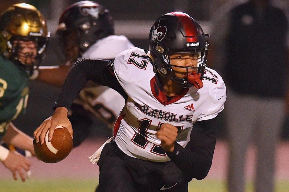 Rolesville quarterback Byrum Brown (17) rushes for yardage during the first quarter. The Cardinal Gibbons Crusaders and the Rolesville Rams met in the NCHSAA 4A East Regional Final in Raleigh, N.C. on December 3, 2021