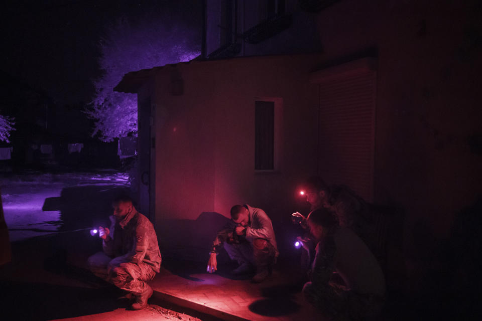 Ukraine Special Operations Forces soldiers wait to leave for a night mission in Kherson region, Ukraine, Friday, June 16, 2023. (AP Photo/Felipe Dana)