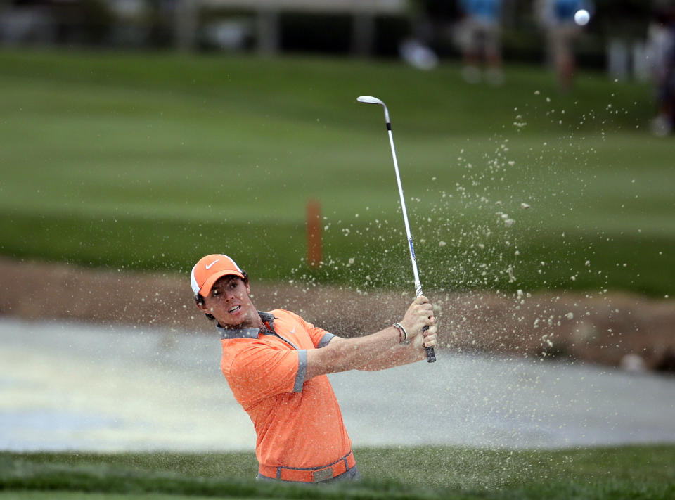 Rory McIlroy, of Northern Ireland, hits out of a bunker onto the 18th green during the first round of the Honda Classic golf tournament, Thursday, Feb. 27, 2014, in Palm Beach Gardens, Fla. McIlroy ended the day at 7 under par. (AP Photo/Lynne Sladky)