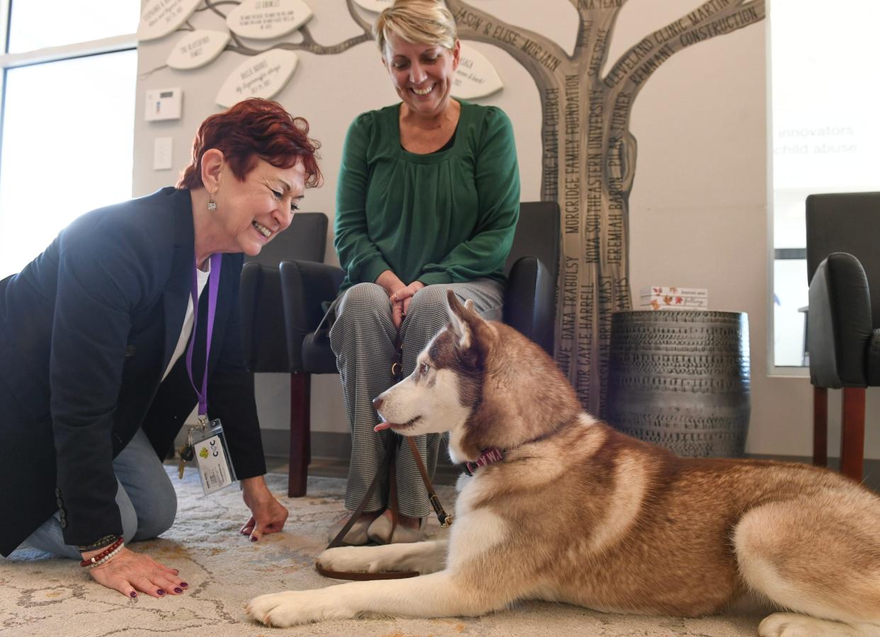 Debbie Butler (left), President of the Children’s Advocacy Center, interacts with Autumn, their therapy dog and handler Wanda Eckhoff, at the end of the day on Friday, Nov. 17, 2023, in St. Lucie West.