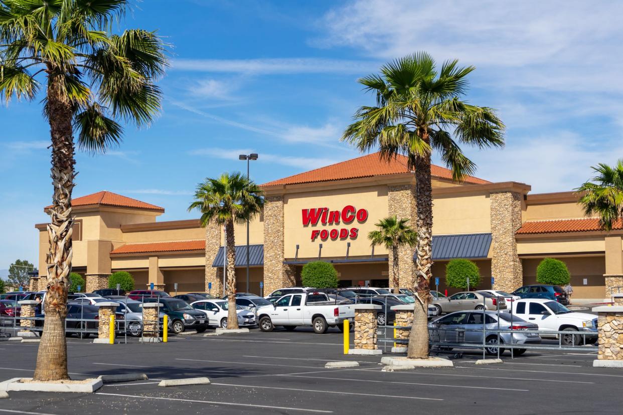 Victorville, CA / USA – May 7, 2020: Parking lot view of the Winco Foods grocery store located in Victorville, California.