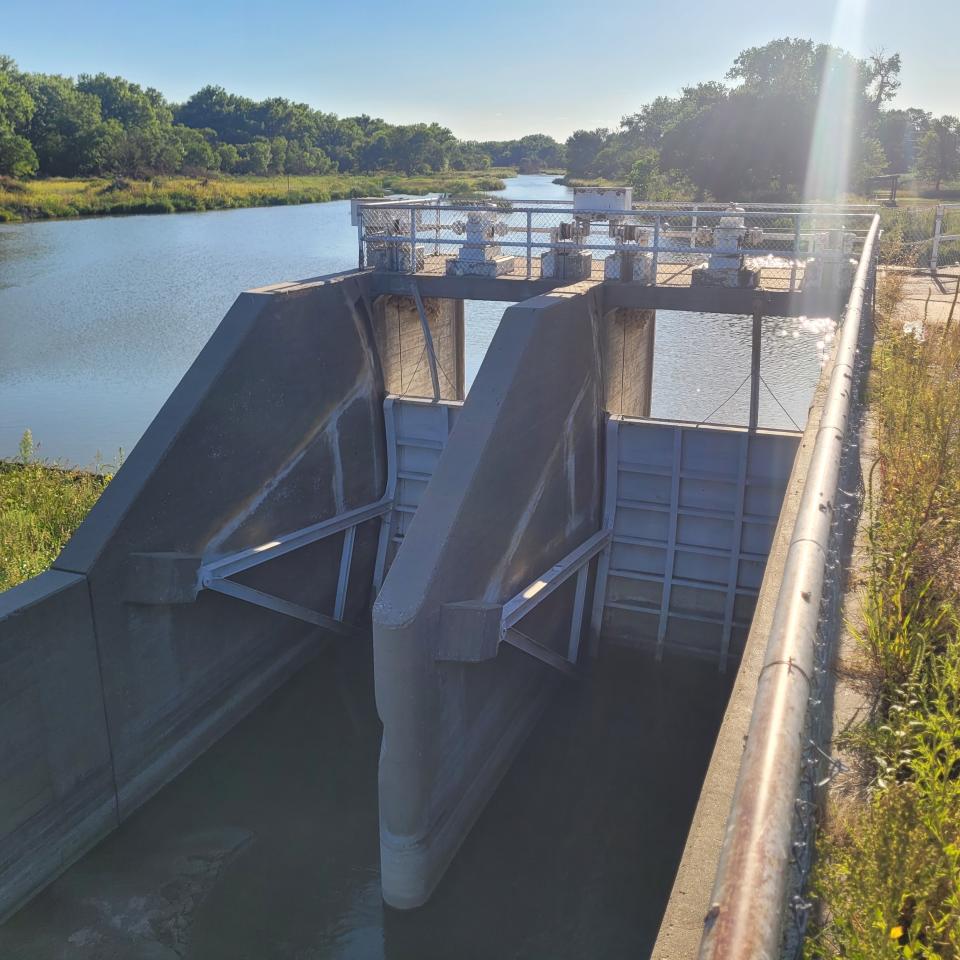 Sluice gates at the Cambridge Canal in south-central Nebraska, are pictured Monday, Aug. 22, 2022. It's a mystery why someone released 16 million gallons of water out of the canal one night earlier this month. (Bradley Edgerton via AP)