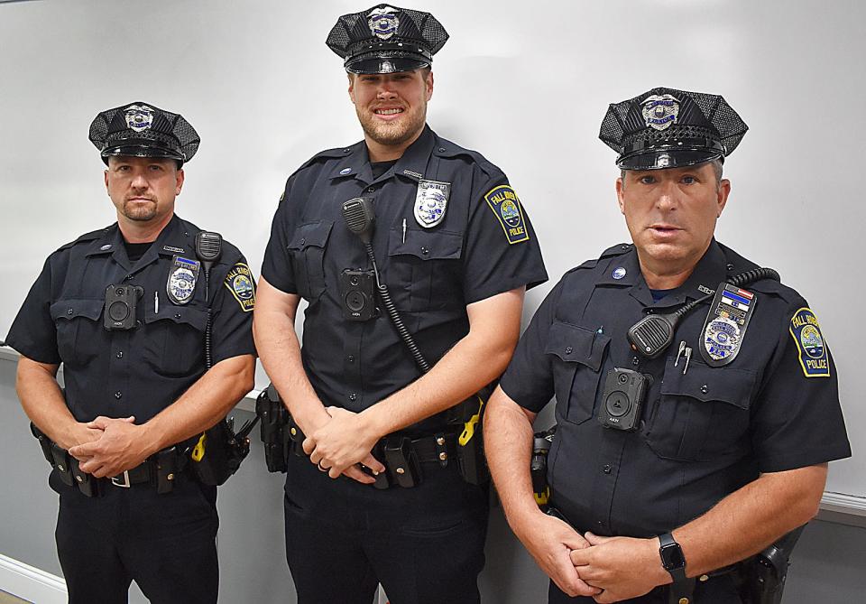 Fall River officers Joshua Carreiro, Tim Magan and Rick Saraiva with new body-worn cameras Friday.