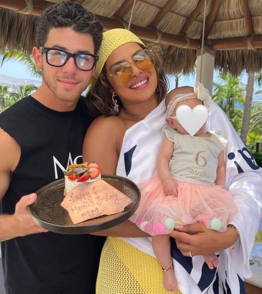 Photograph of Priyanka Chopra and Nick Jonas with their baby. (priyankachopra  / via Instagram)