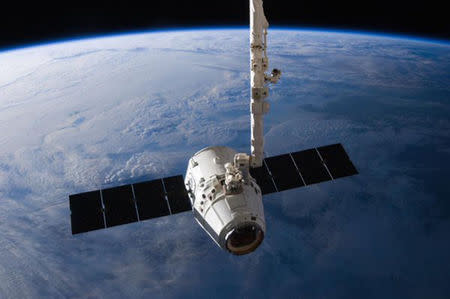 The SpaceX Dragon cargo capsule approaches the International Space Station prior to installation in this NASA picture taken April 10, 2016. REUTERS/NASA via social media/Handout via Reuters