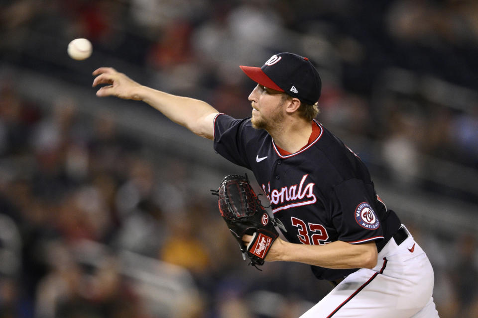 Washington Nationals starting pitcher Erick Fedde throws during the fifth inning of the team's baseball game against the Milwaukee Brewers, Friday, June 10, 2022, in Washington. (AP Photo/Nick Wass)