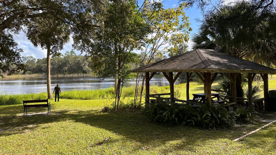 A park visitor observes a quiet moment at Seneca Park along the shores of Lake Colby, one of several parks in Cassadaga. - Terry Ward