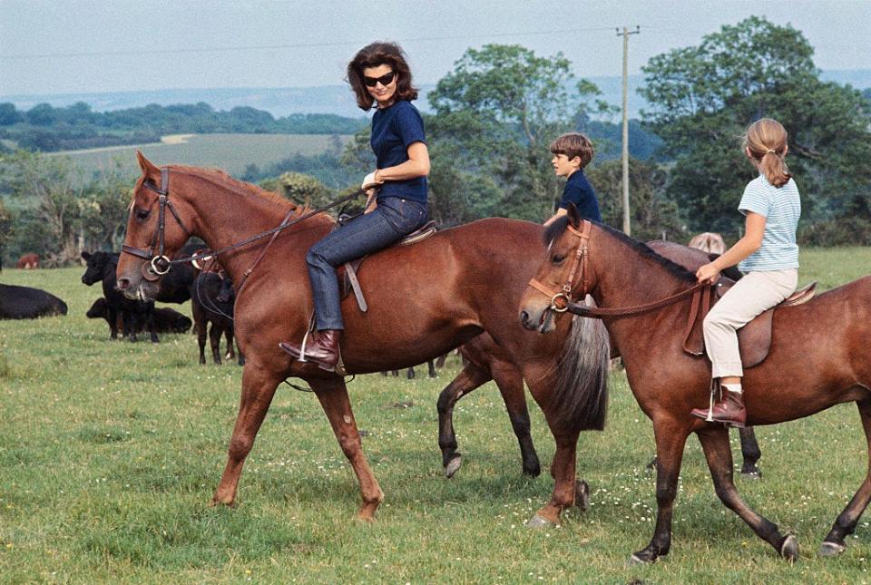 Jackie Kennedy, accompanied by her children, Caroline and John Jr., appear at press conference here June 16th on horseback in Ireland.