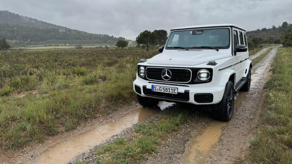 white g580 ev g class electric on muddy trail in france