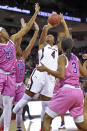 South Carolina's Aliyah Boston (4) shoots while defended by LSU's Faustine Aifuwa (24) Awa Trasi (0) and Khayla Pointer during the first half of an NCAA college basketball game Thursday, Feb. 20, 2020, in Columbia, S.C. (AP Photo/Richard Shiro)