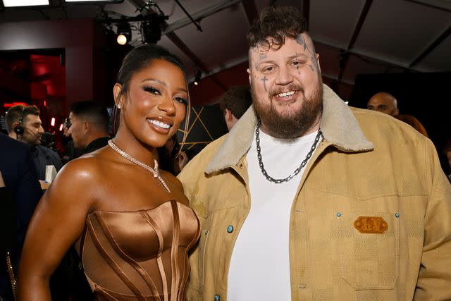 <p>Lester Cohen/Getty</p> Victoria Monét and Jelly Roll