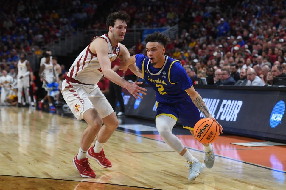 South Dakota State guard Zeke Mayo (2) drives to the basket during the second half of a game March 21, 2024 at the CHI Health Center in Omaha, Nebraska.